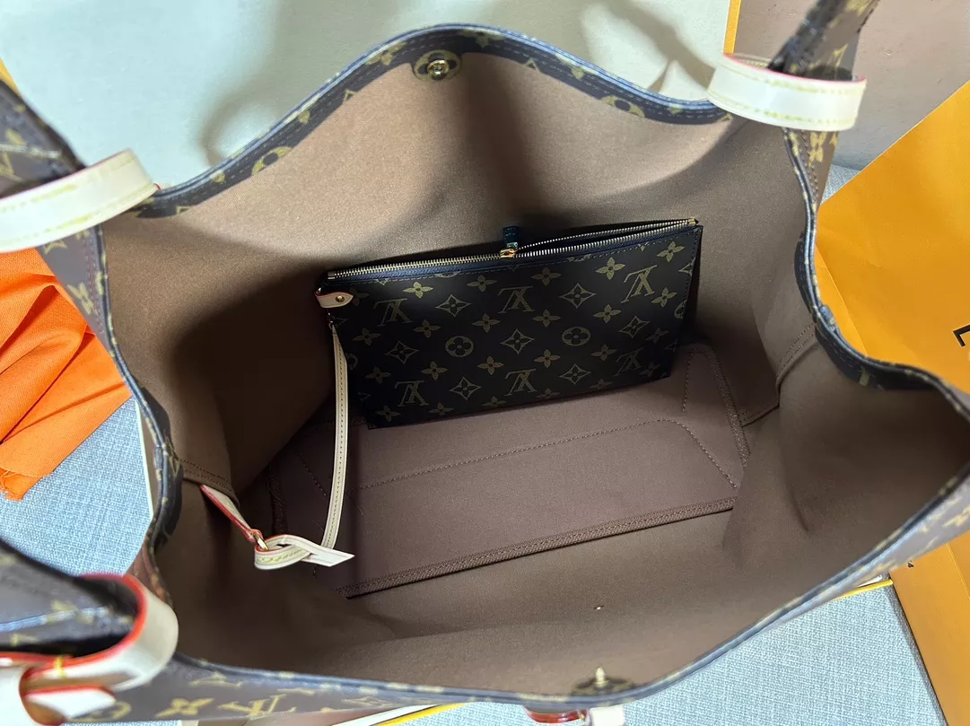 Louis Vuitton Atlantis GM in Coated Canvas with Gold-tone