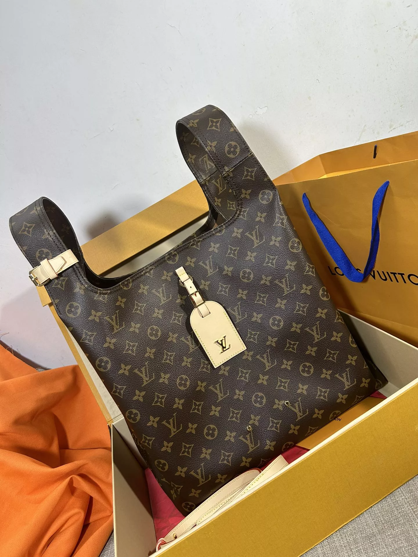 Louis Vuitton Atlantis GM in Coated Canvas with Gold-tone