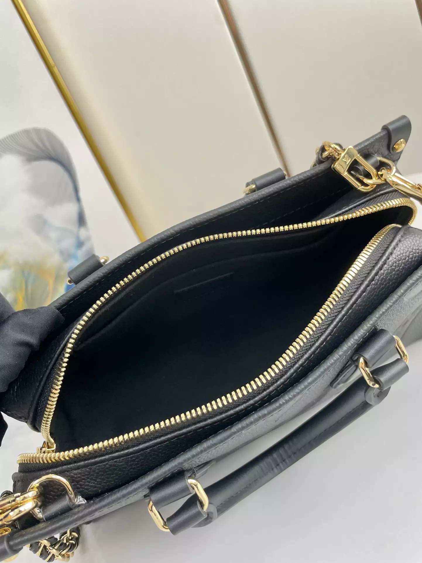 OnTheGo East West Monogram Empreinte Black Leather