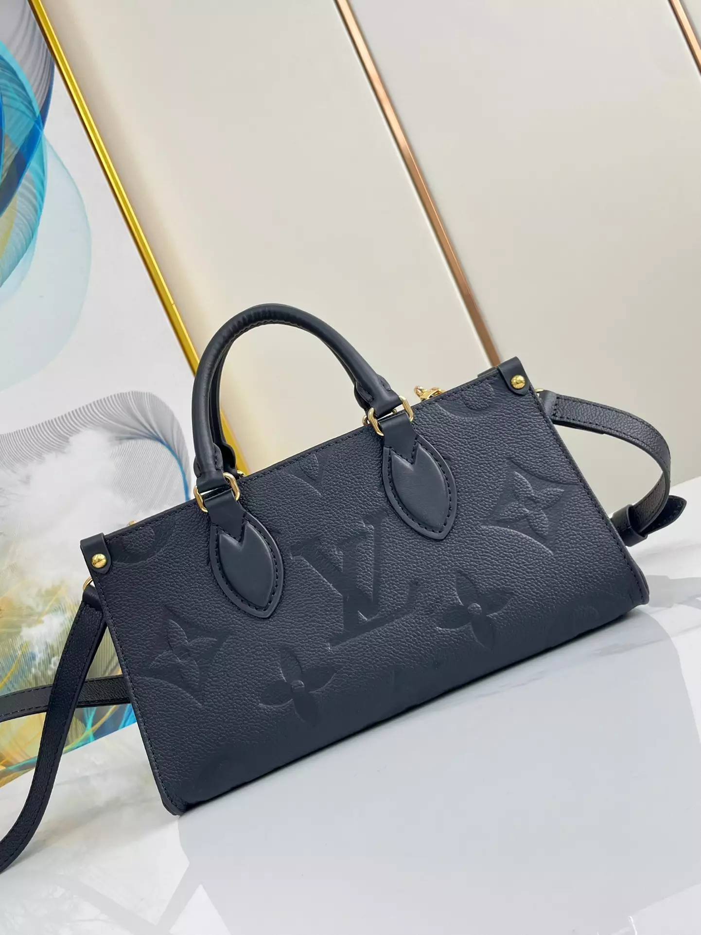 OnTheGo East West Monogram Empreinte Black Leather
