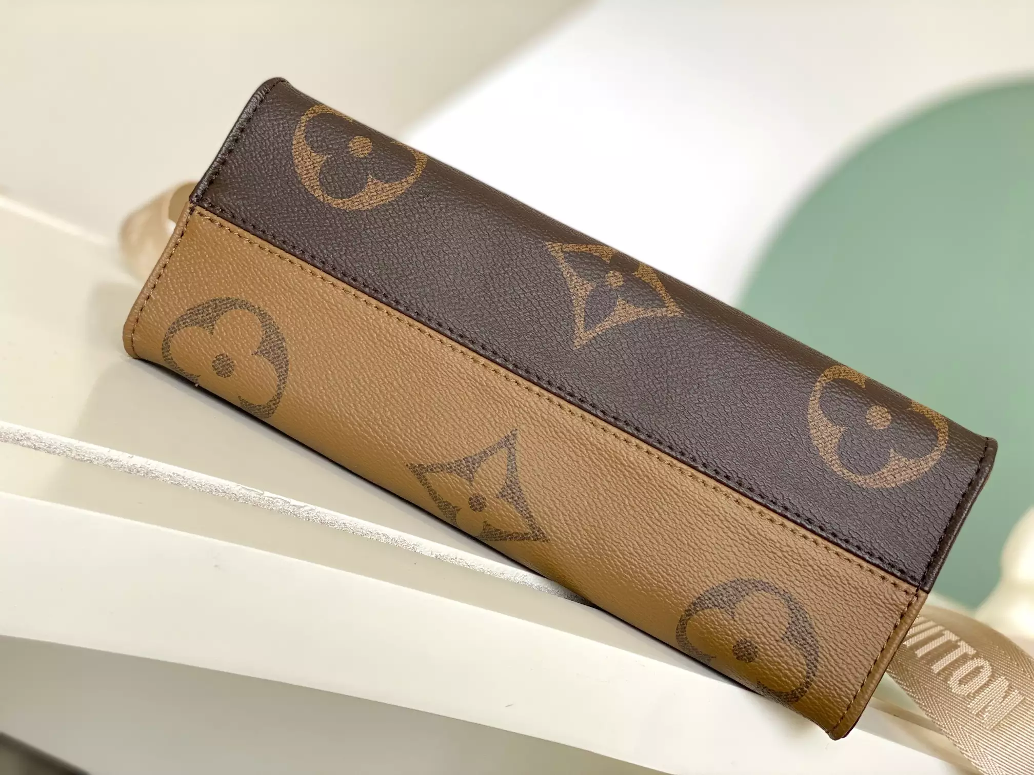 Onthego East West Monogram Reverse Brown Latte