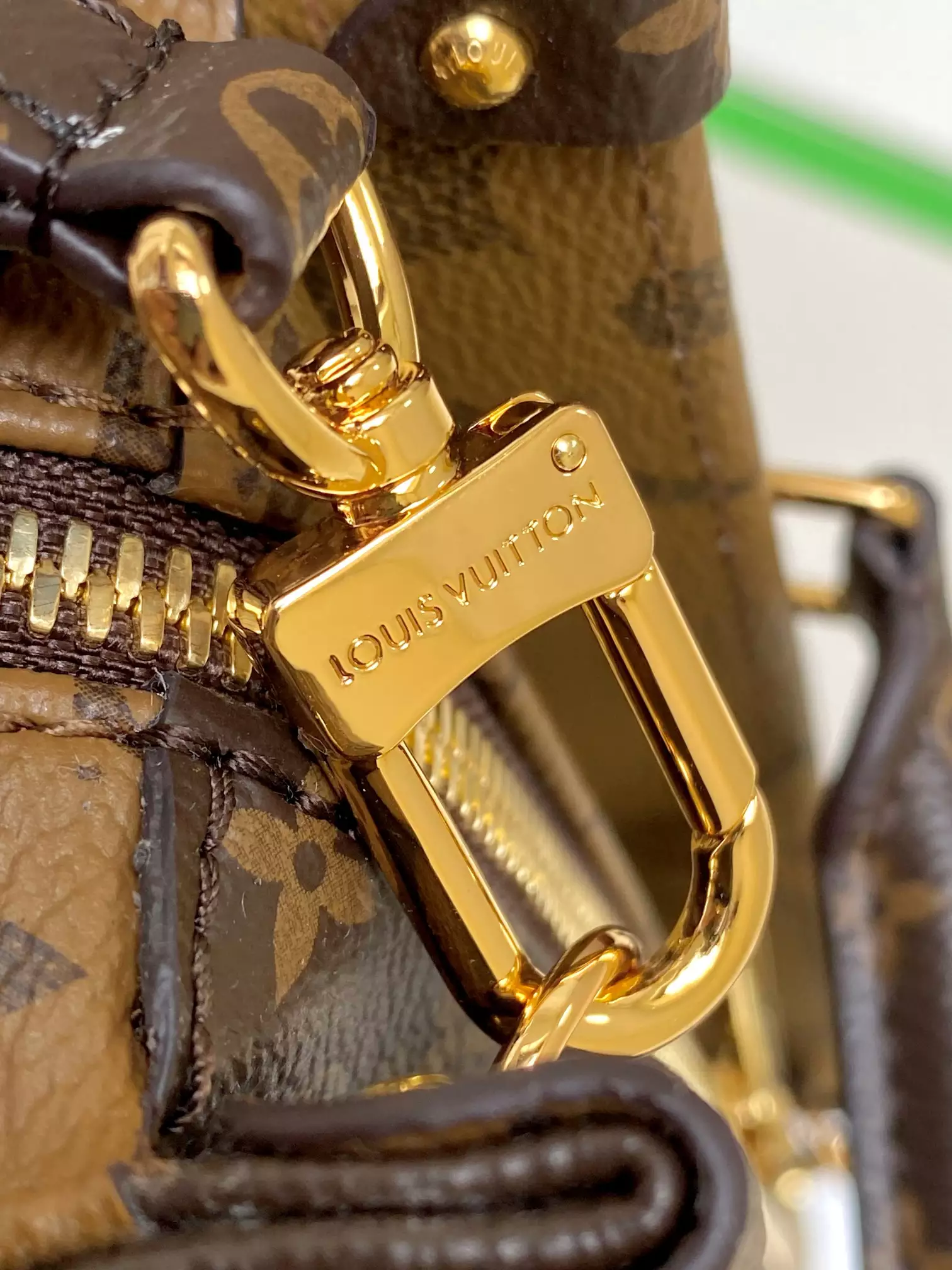 Onthego East West Monogram Reverse Brown Latte