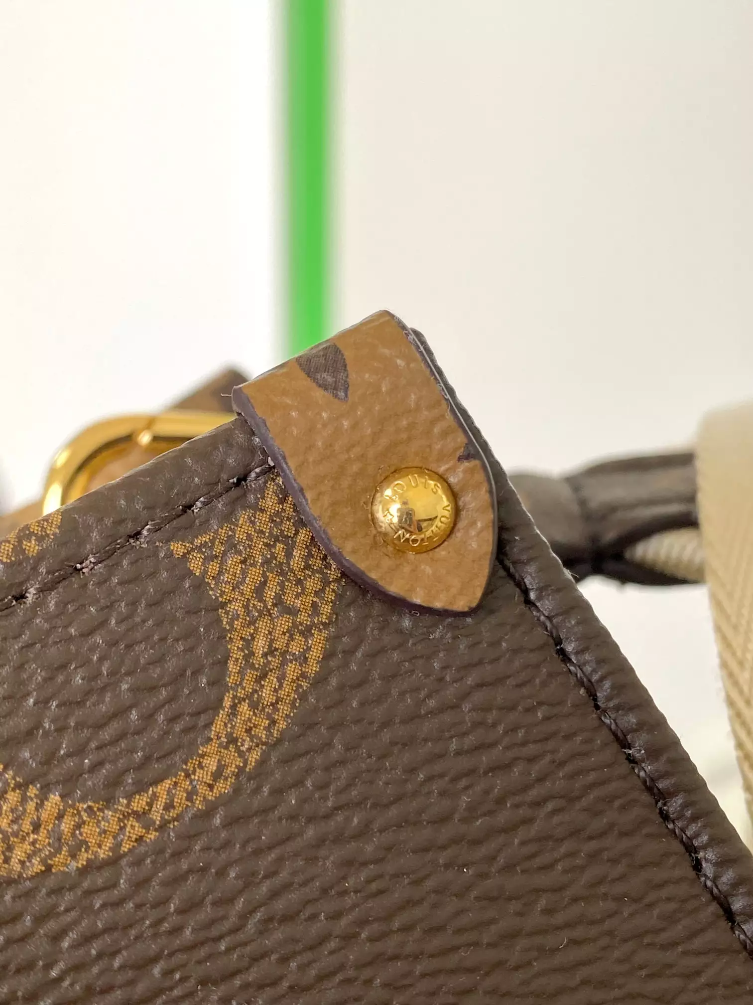 Onthego East West Monogram Reverse Brown Latte