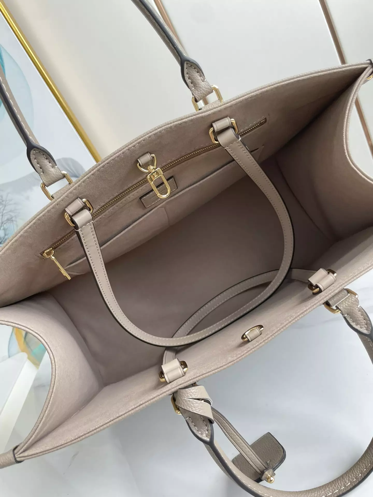 OnTheGo MM Bicolor Monogram Empreinte Dove Grey/Cream Leather