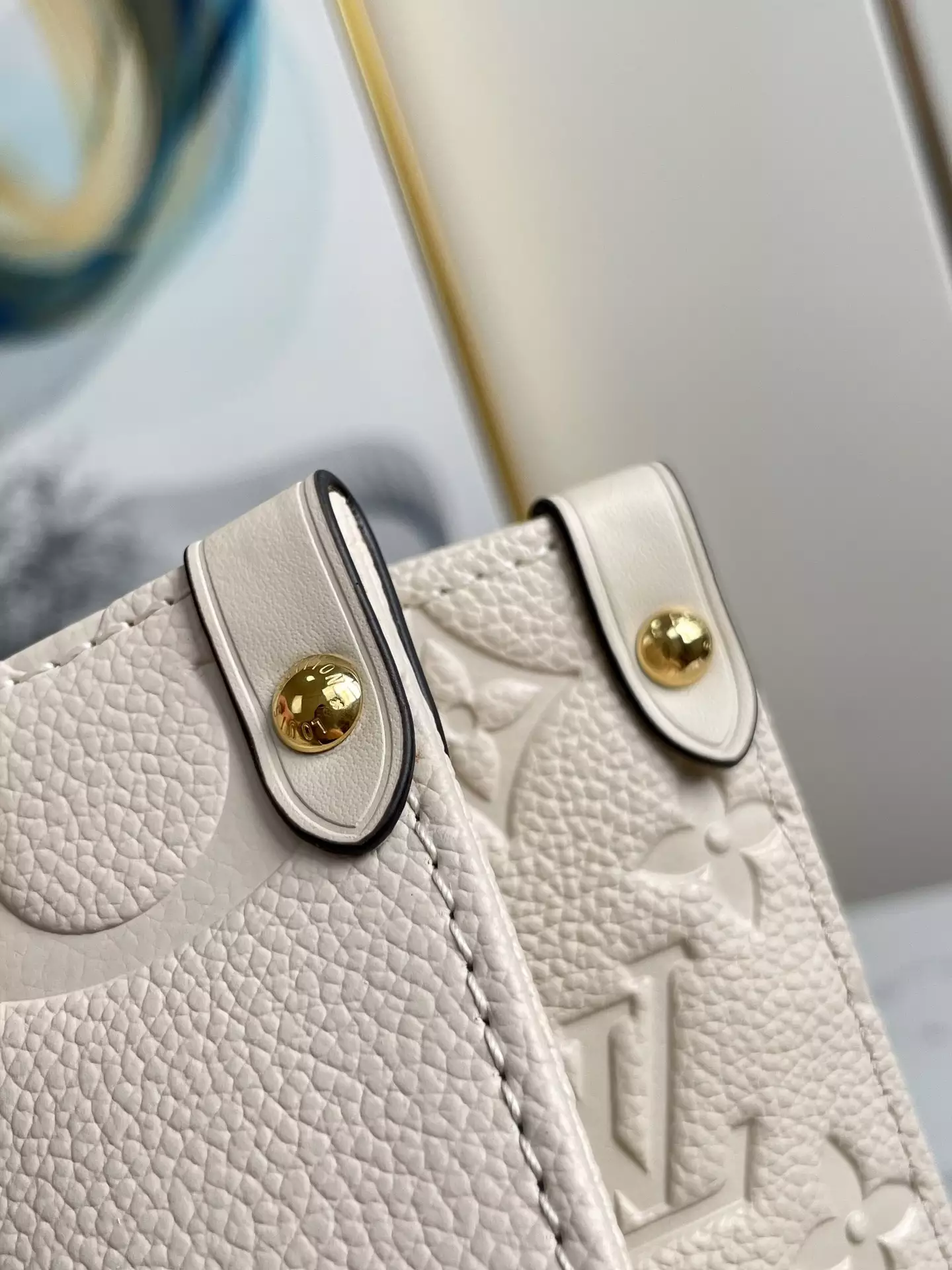 OnTheGo MM Monogram Empreinte Cream Leather
