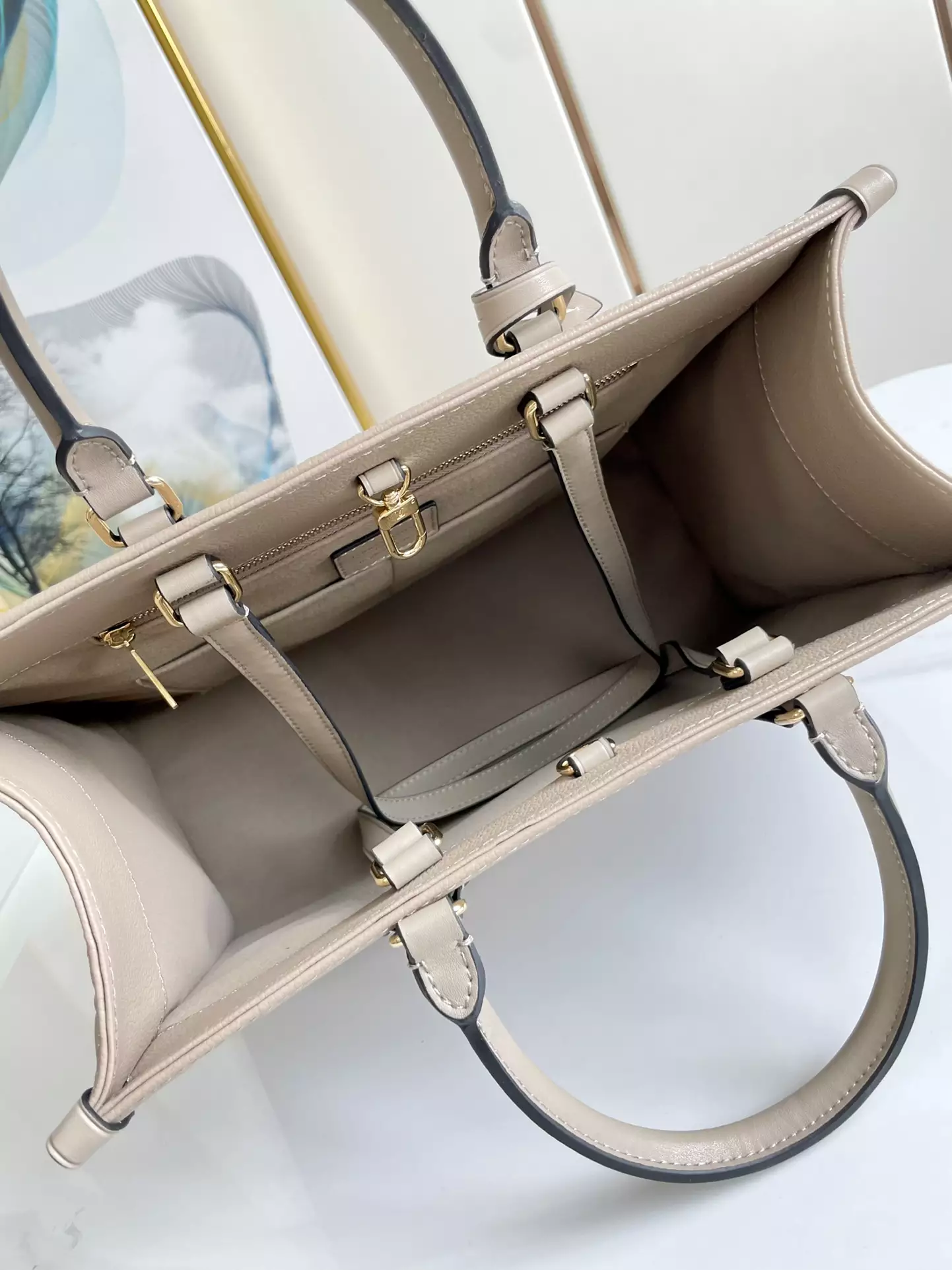 OnTheGo MM Monogram Empreinte Dune Leather