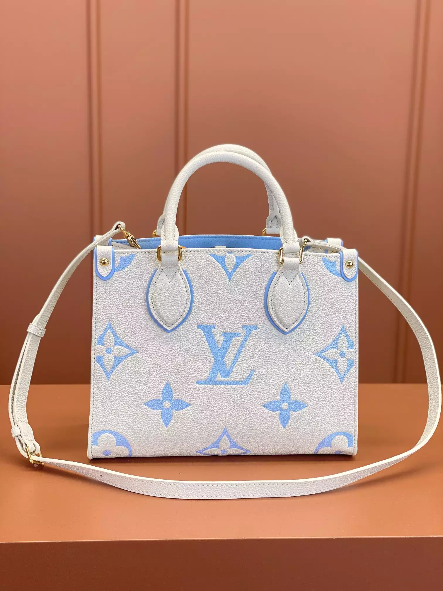 OnTheGo PM Bicolor Monogram Empreinte Latte/Candy Blue Leather