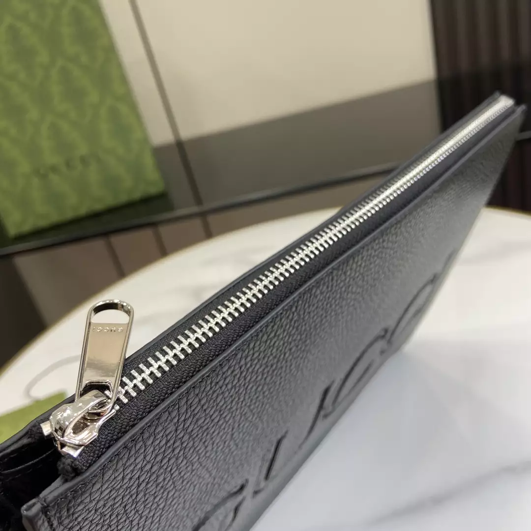 G*u*i pouch with strap in black leather