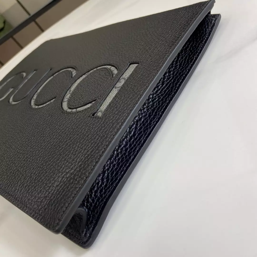 G*u*i pouch with strap in black leather