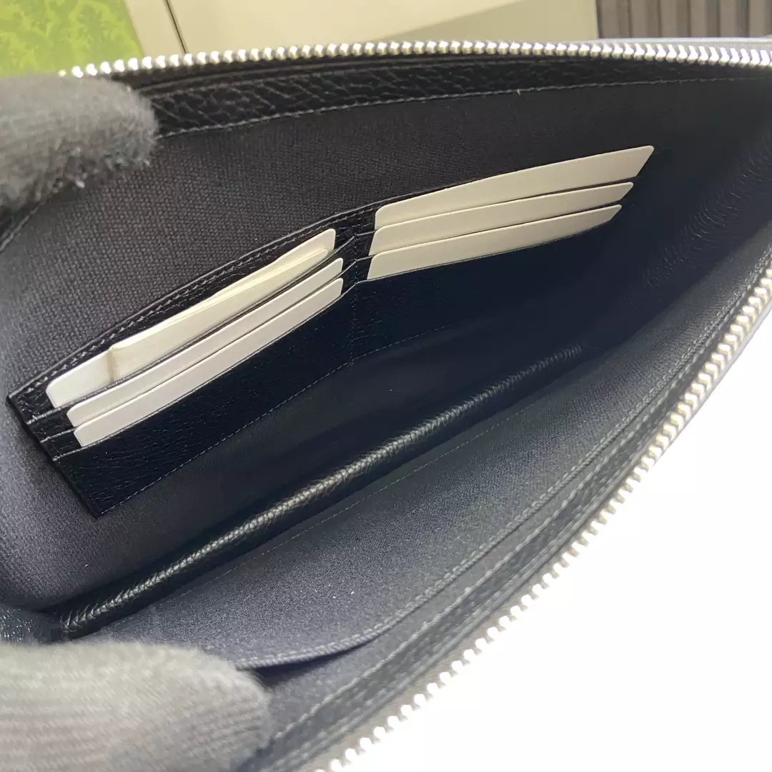 G*u*i pouch with strap in black leather